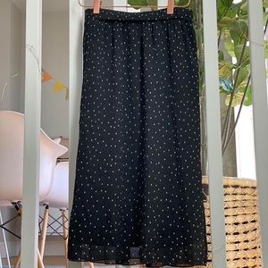 Black midi skirt with polka dots.